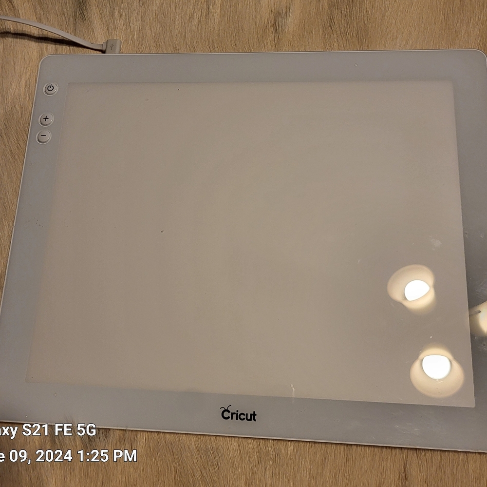 Cricut Bright Pad for weeding Vinyl.